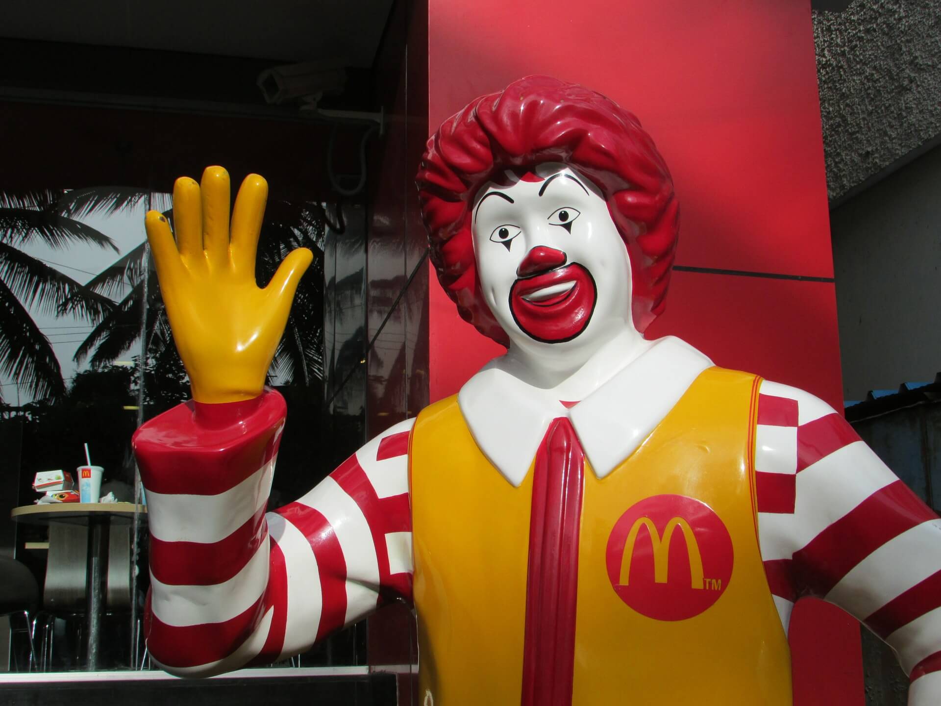 Statue of McDonald's mascot Ronald McDonald waving
