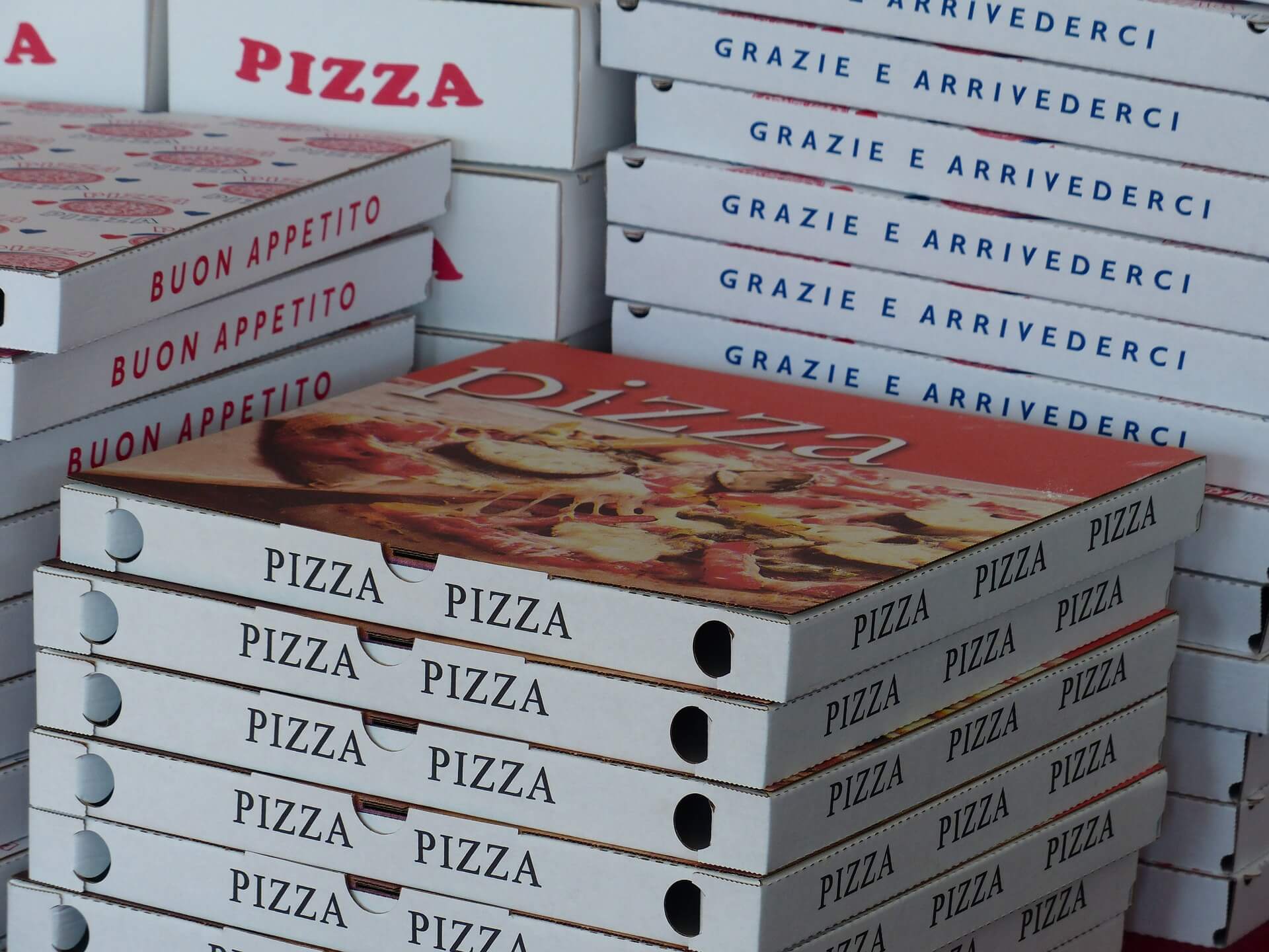 Stacks of pizza boxes