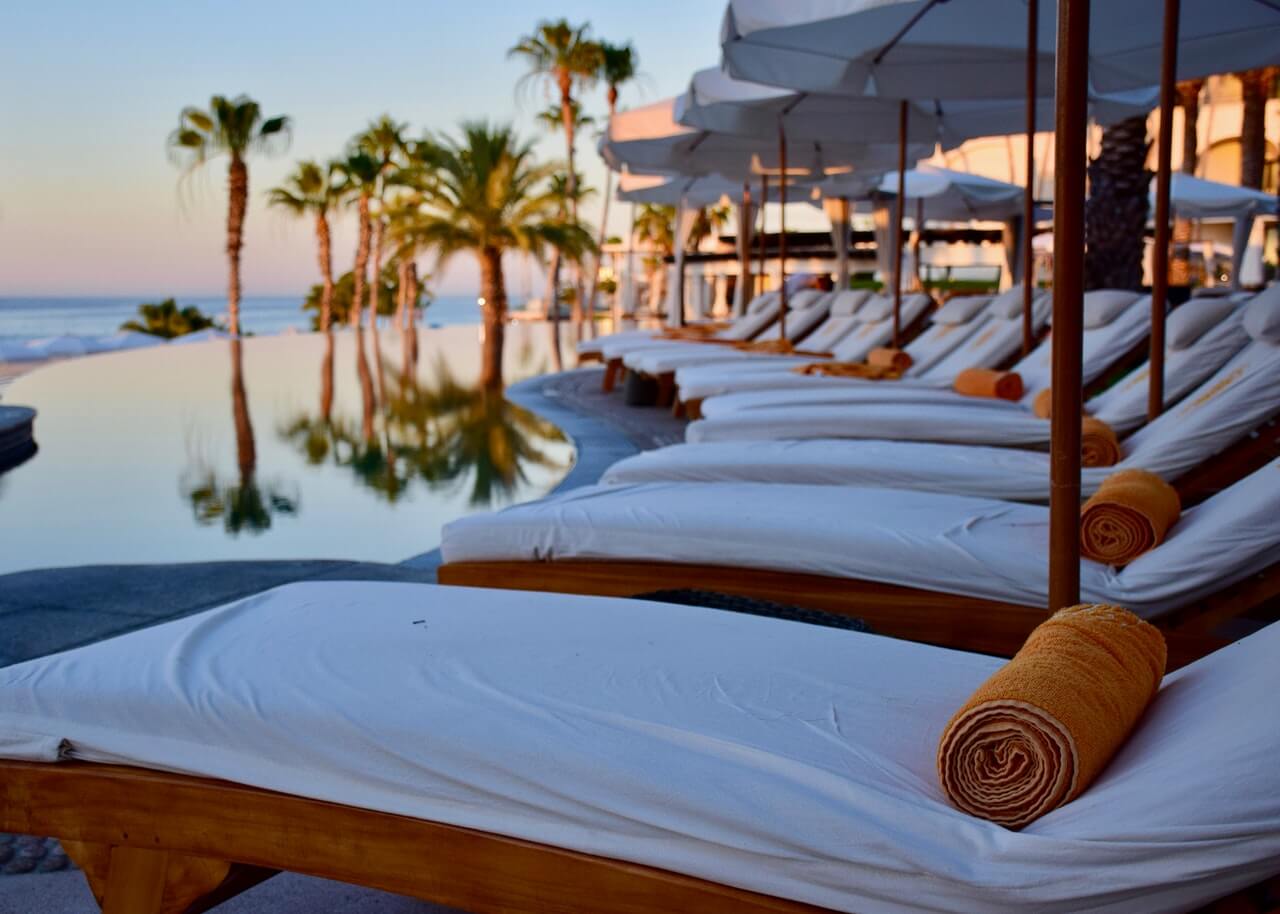 Poolside seating at luxury resort hotel in Cabo San Lucas