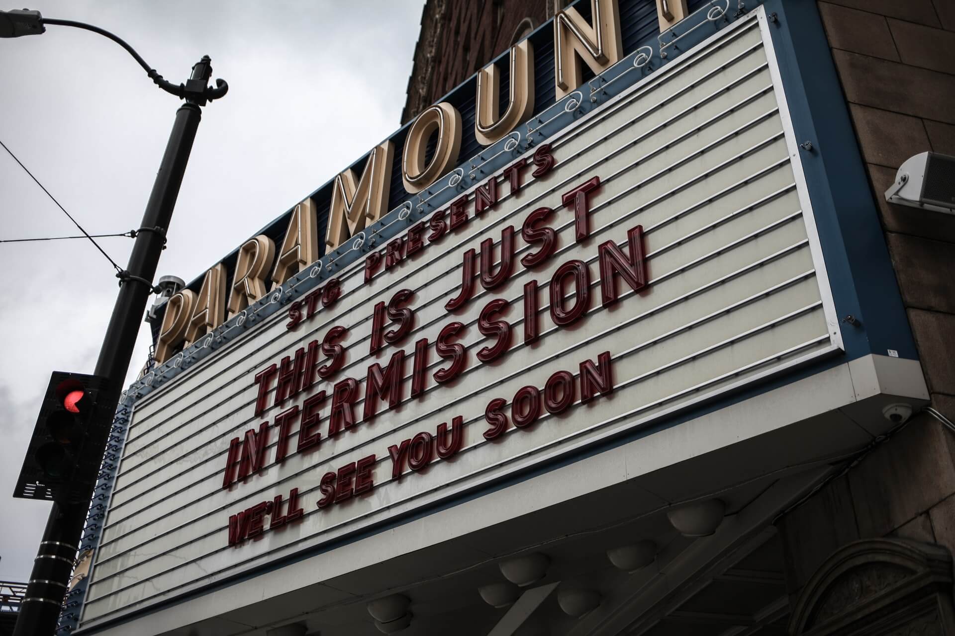Movie theater sign that reads "This is just intermission" temporary closure message