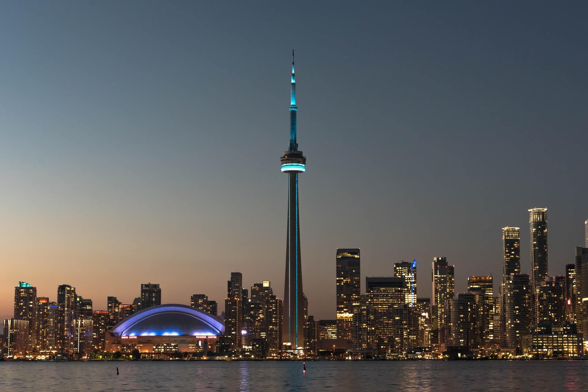 Toronto, Ontario, Canada skyline viewed from harbor at dusk