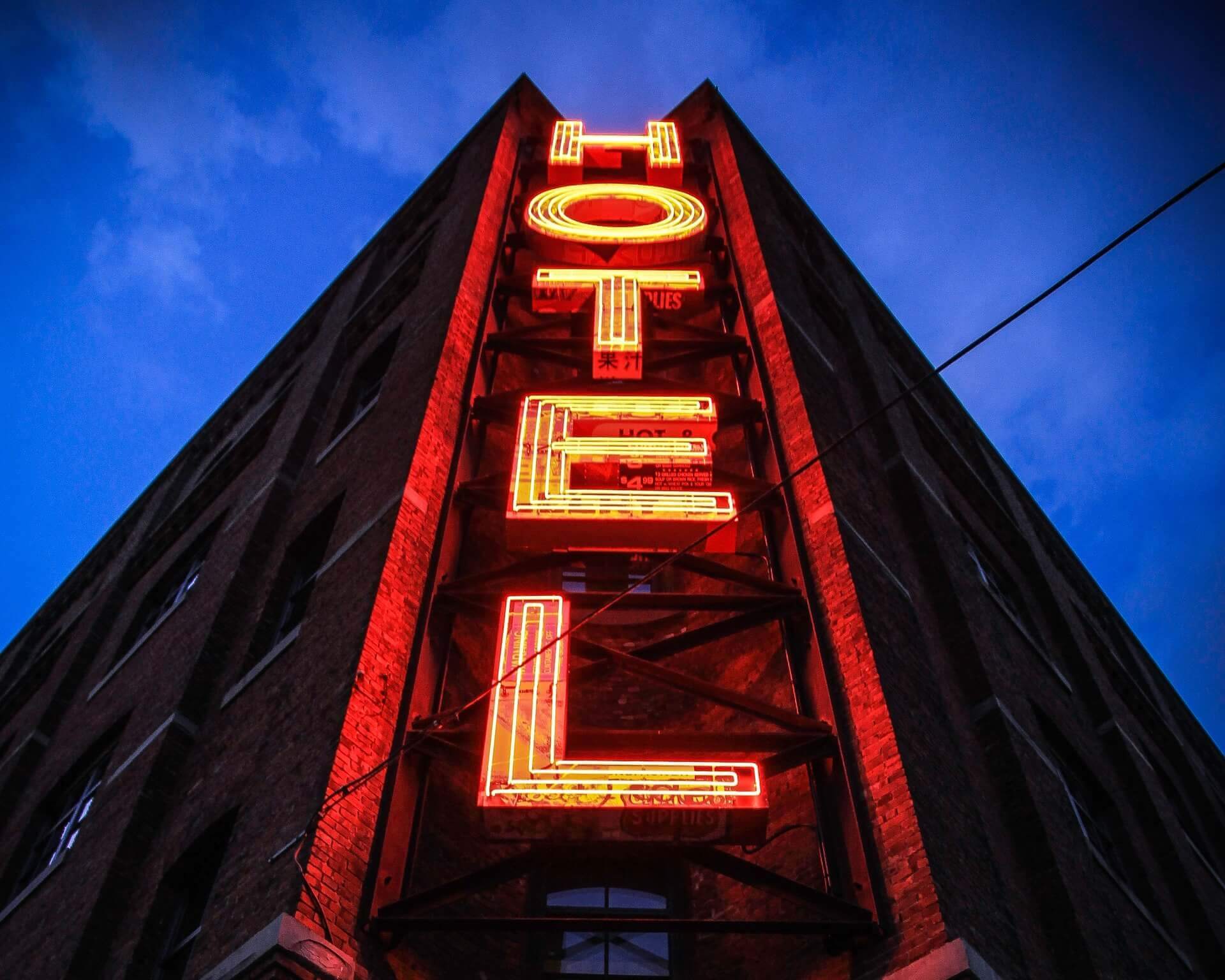 Perspective shot of neon hotel sign