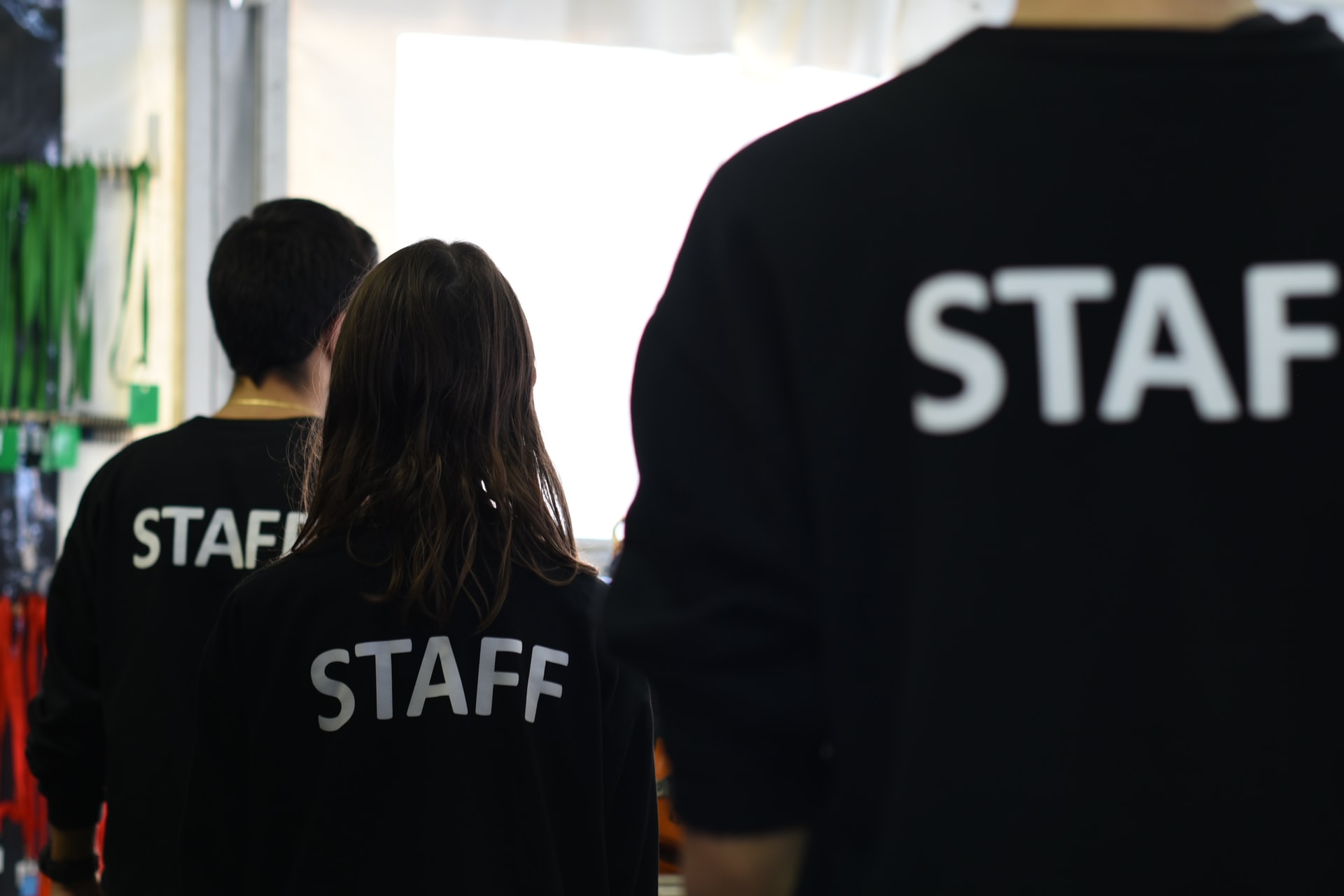 Employees wearing black staff T-shirts