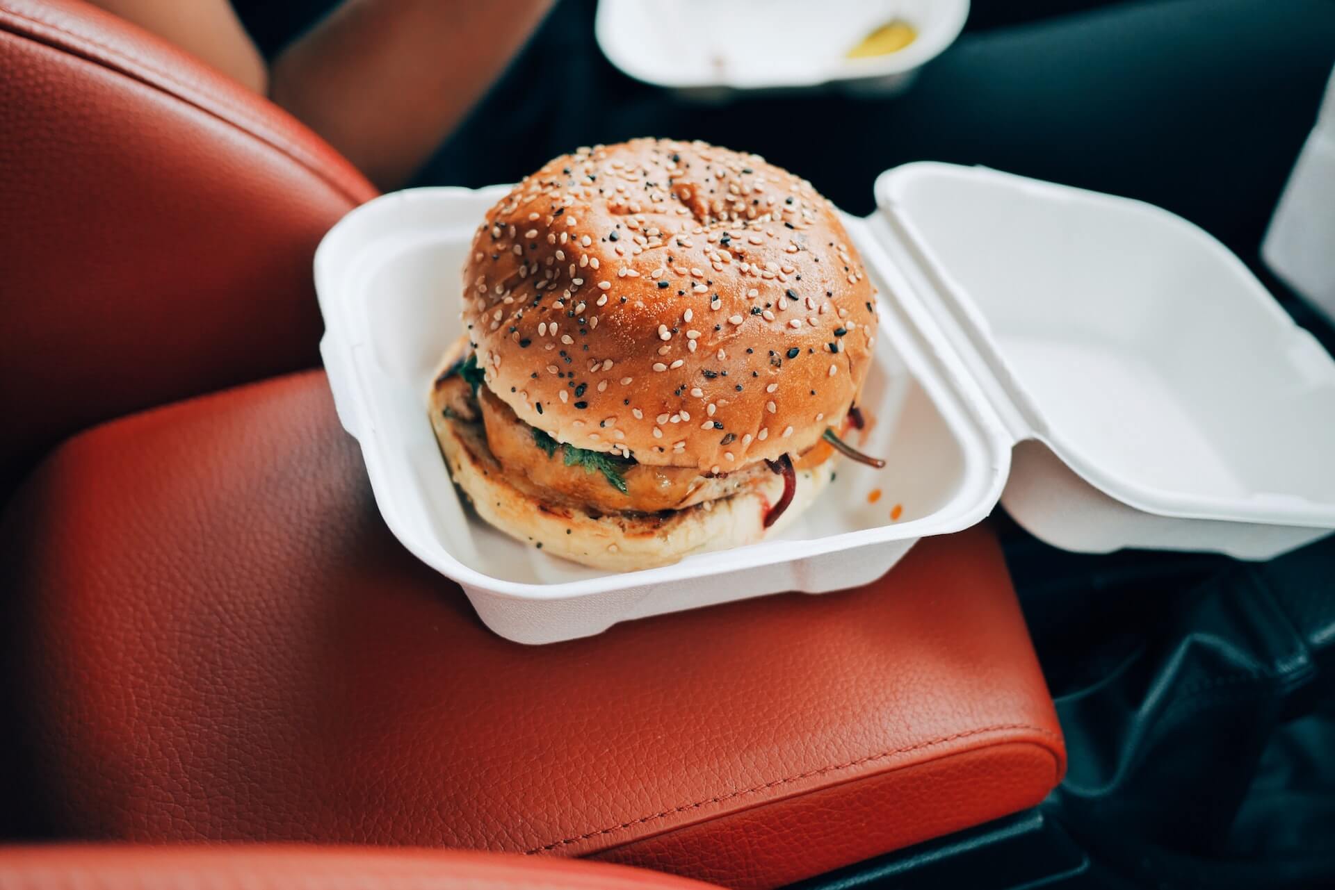 Burger in container inside car