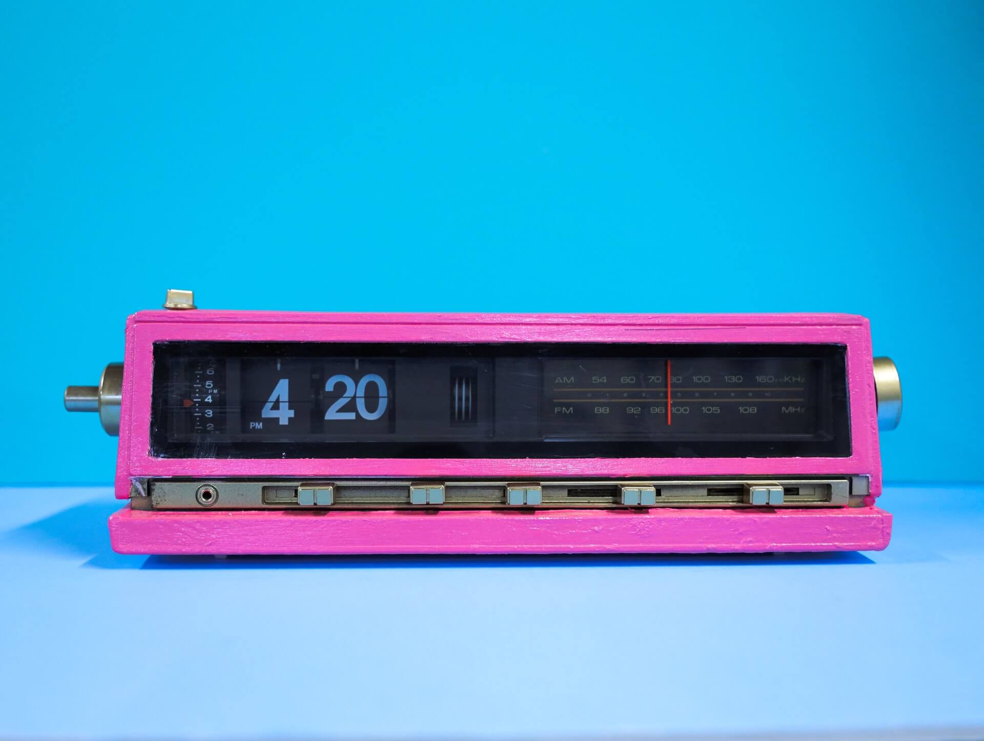 Pink alarm clock that reads 4:20