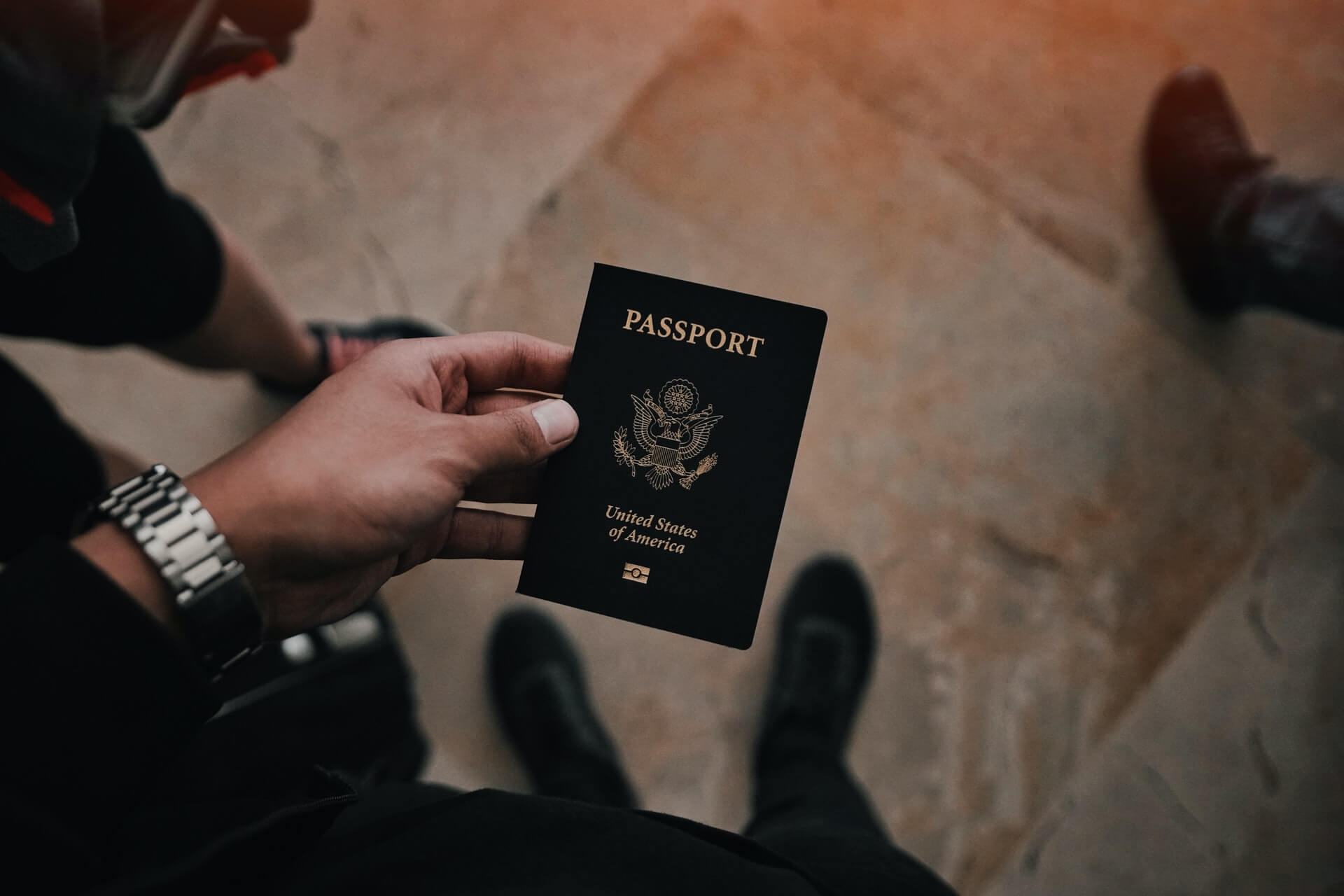 Hand holding United States of America passport