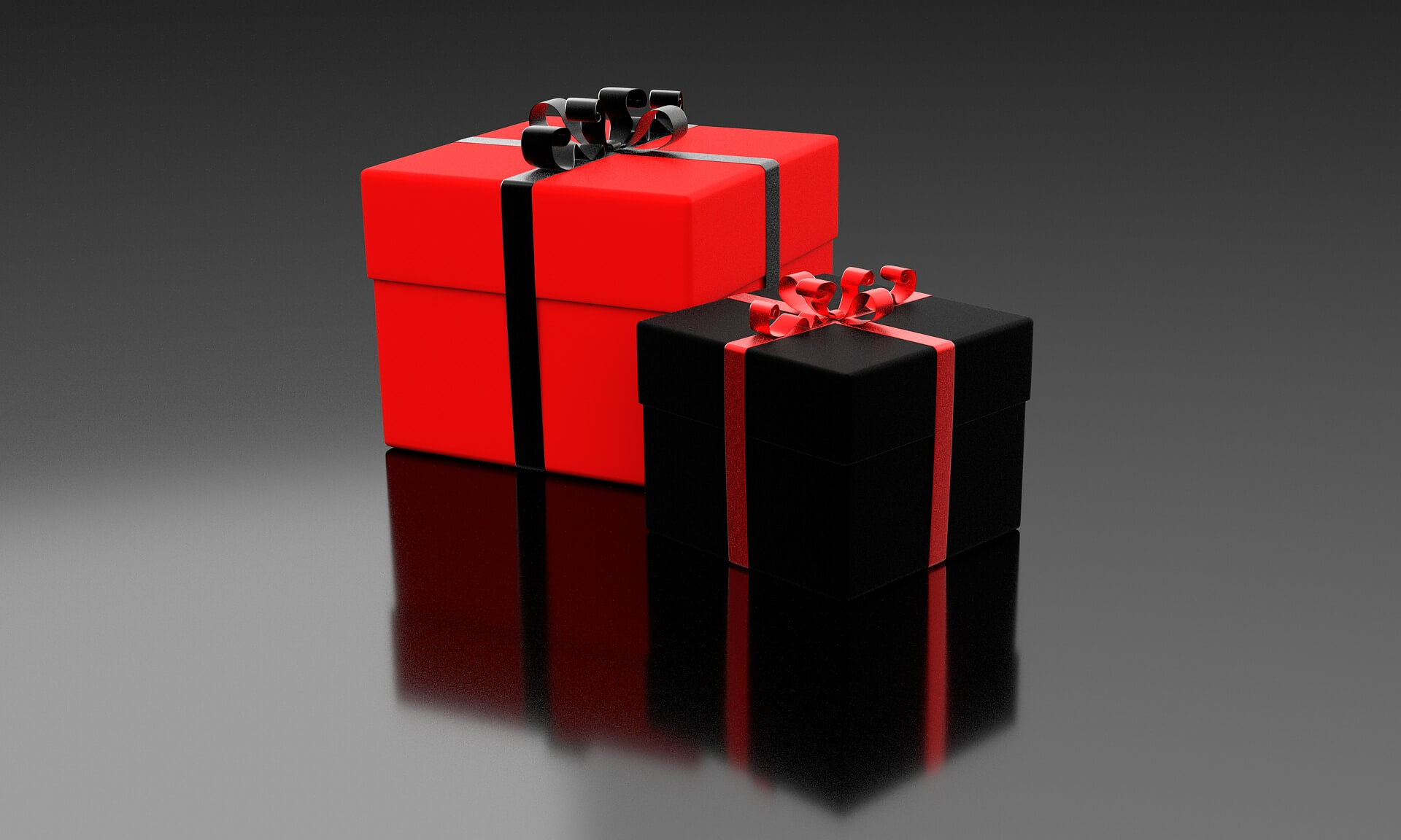 Black and red gift boxes with red and black bows