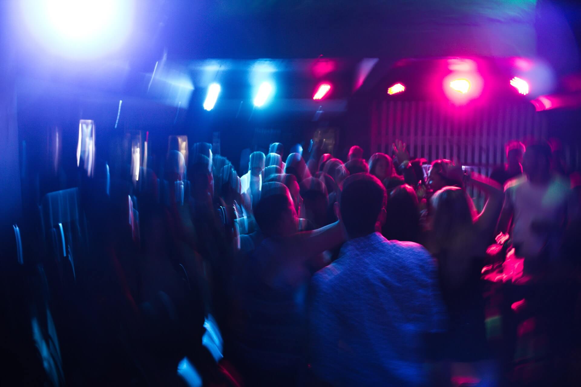 Blurry image of people in a nightclub or bar