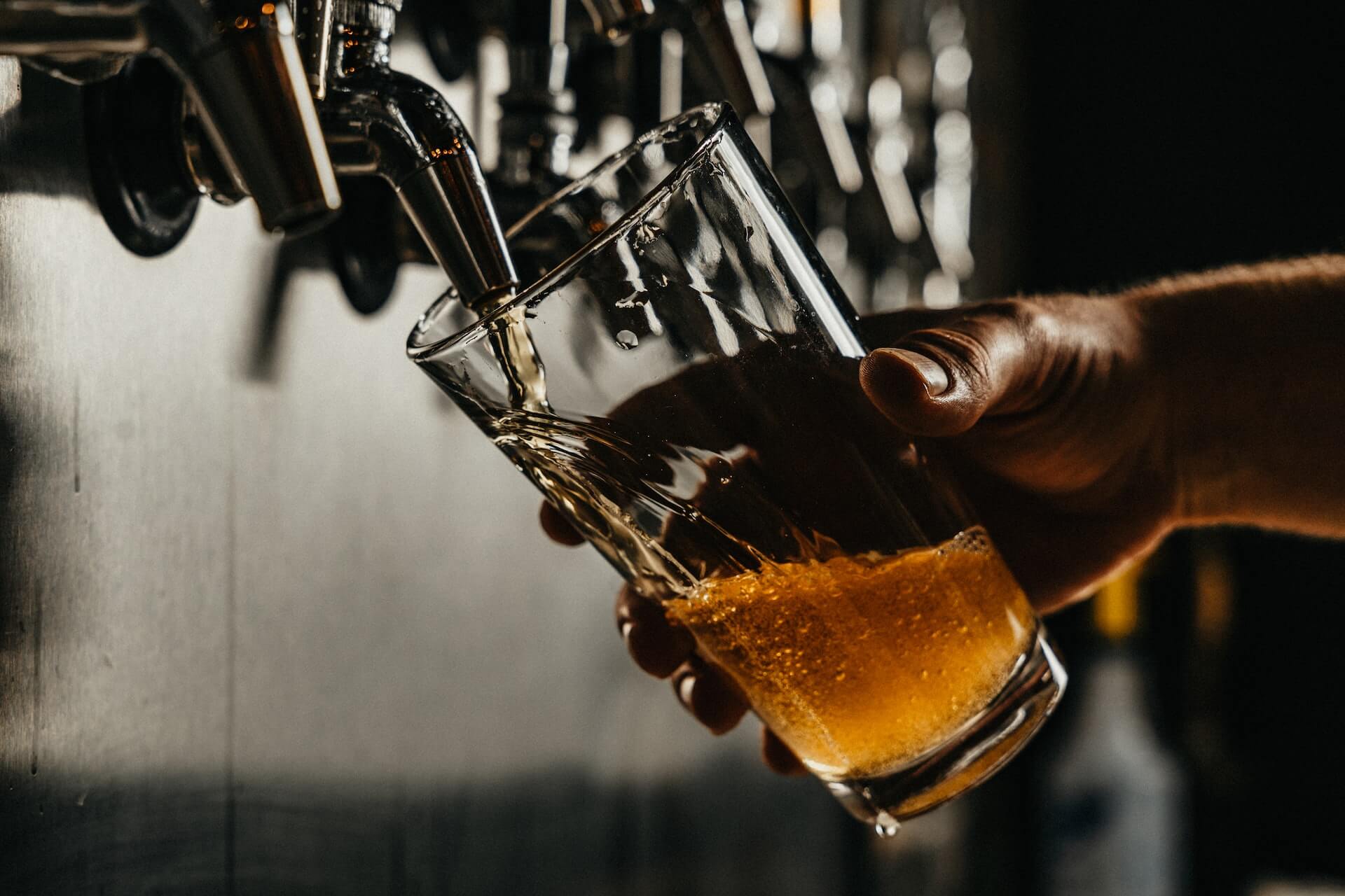 Person pouring draught beer