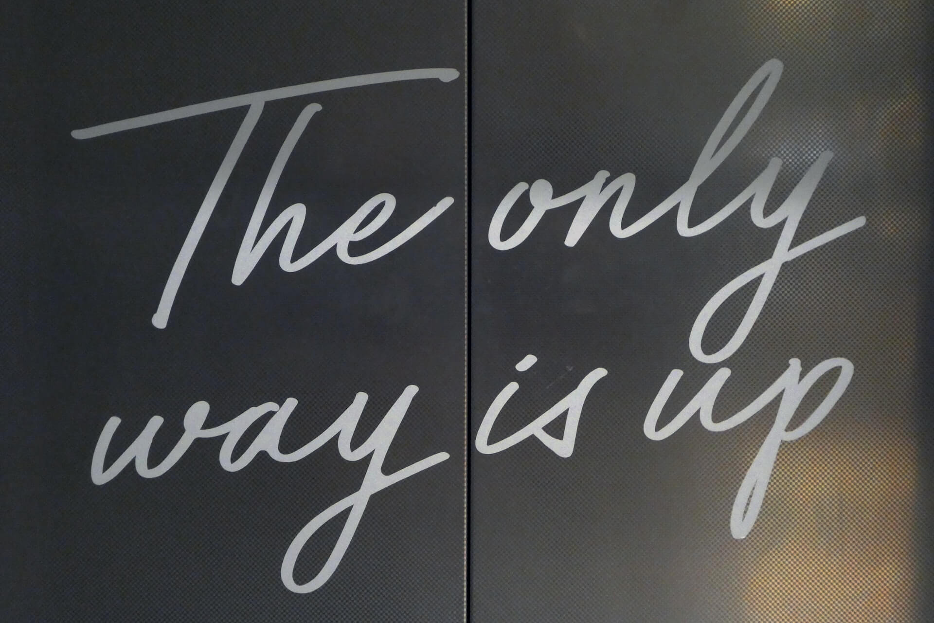 "The only way is up" sign