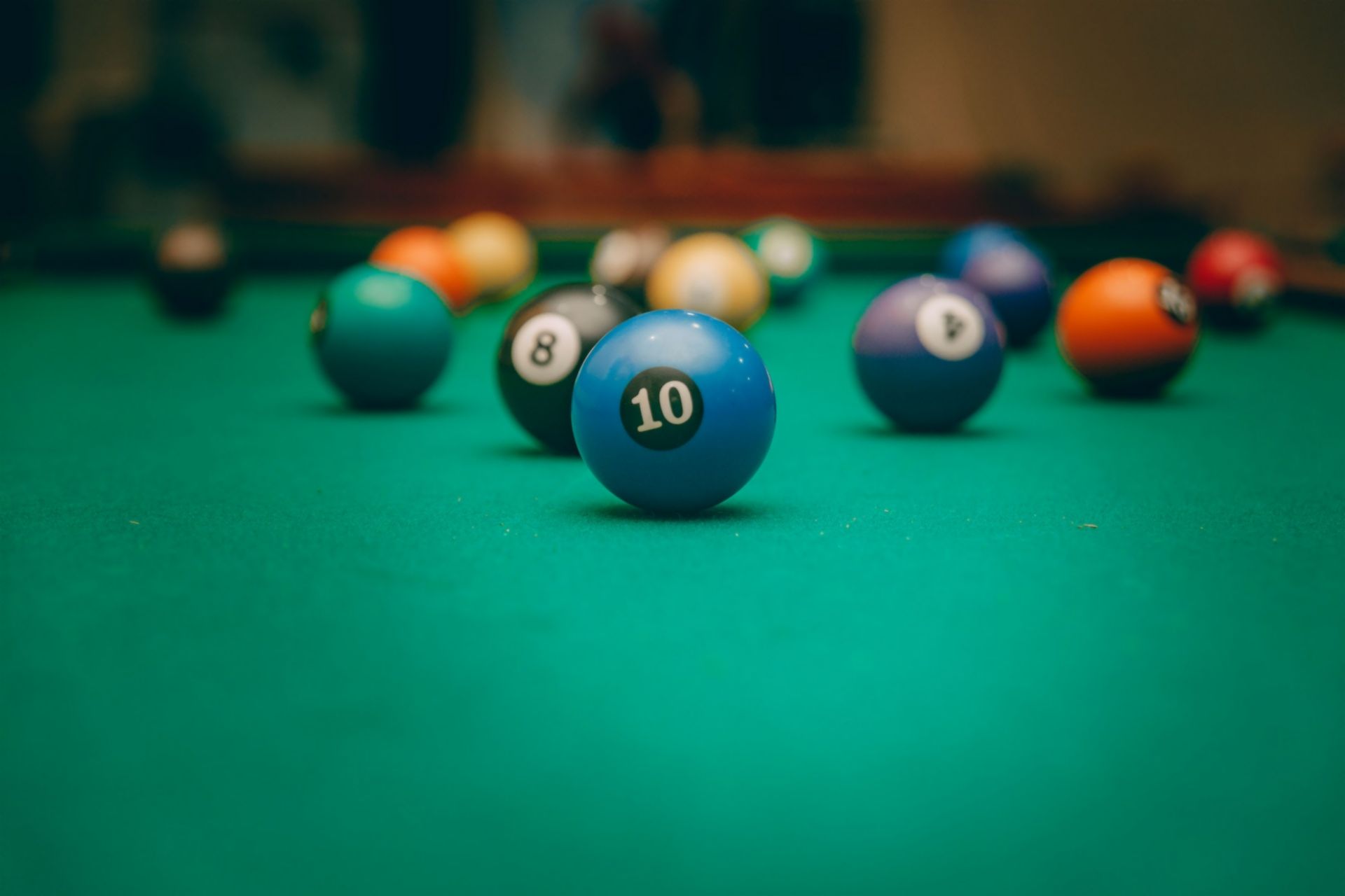 Pool table with number 10 ball in focus