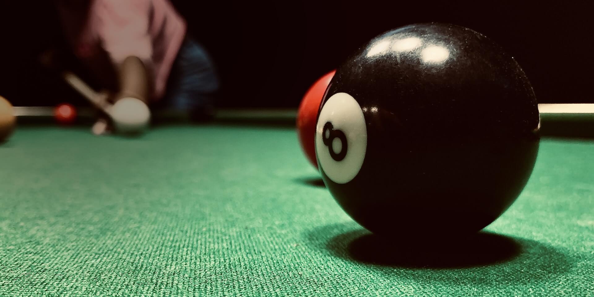 Closeup of eight ball on pool table