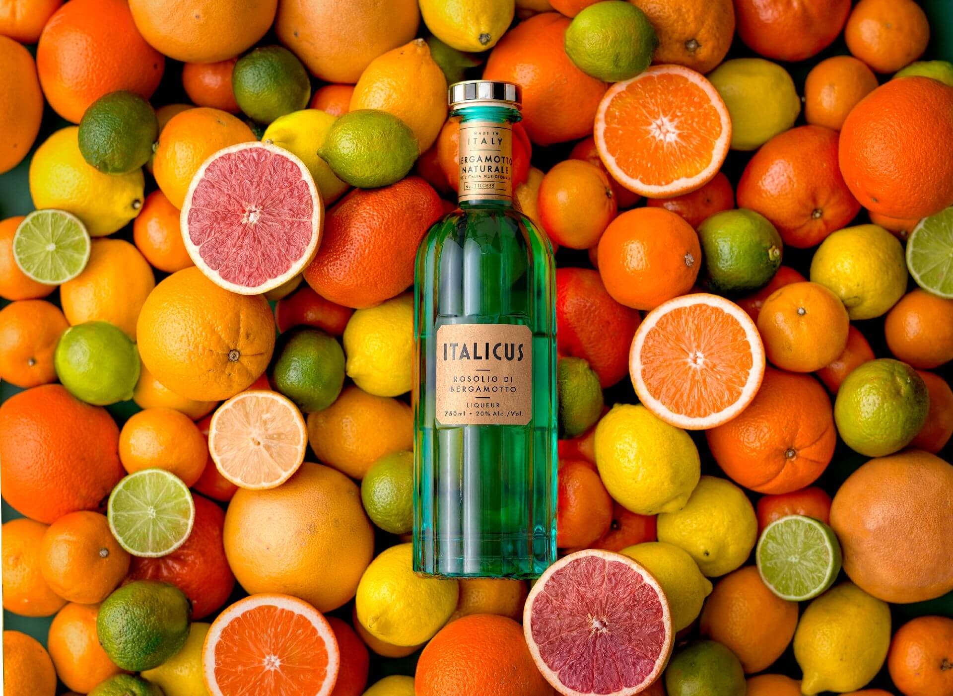 ITALICUS bottle surrounded by citrus fruits