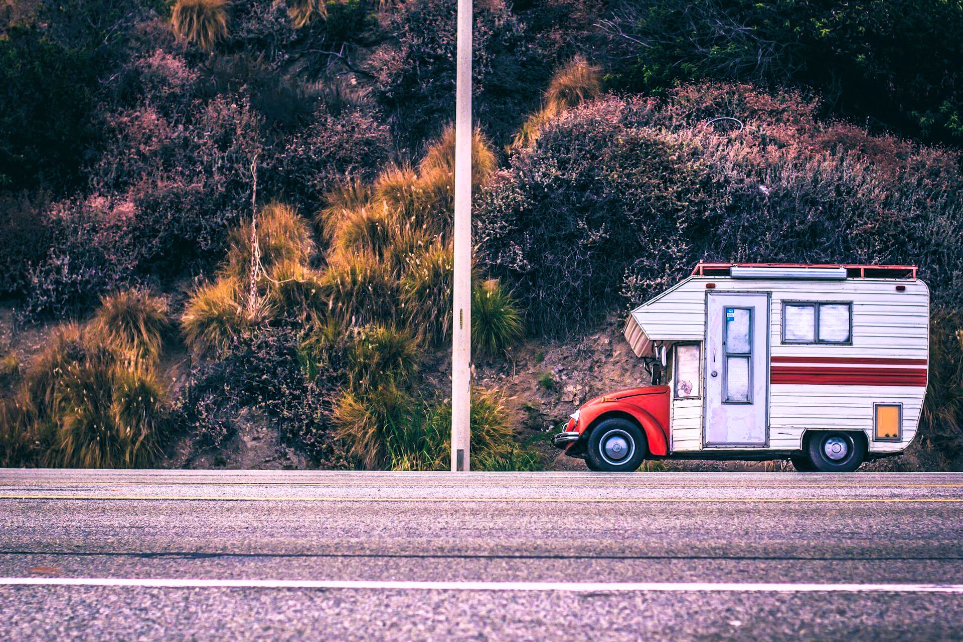 Small campervan made from VW Beetle on the side of the highway