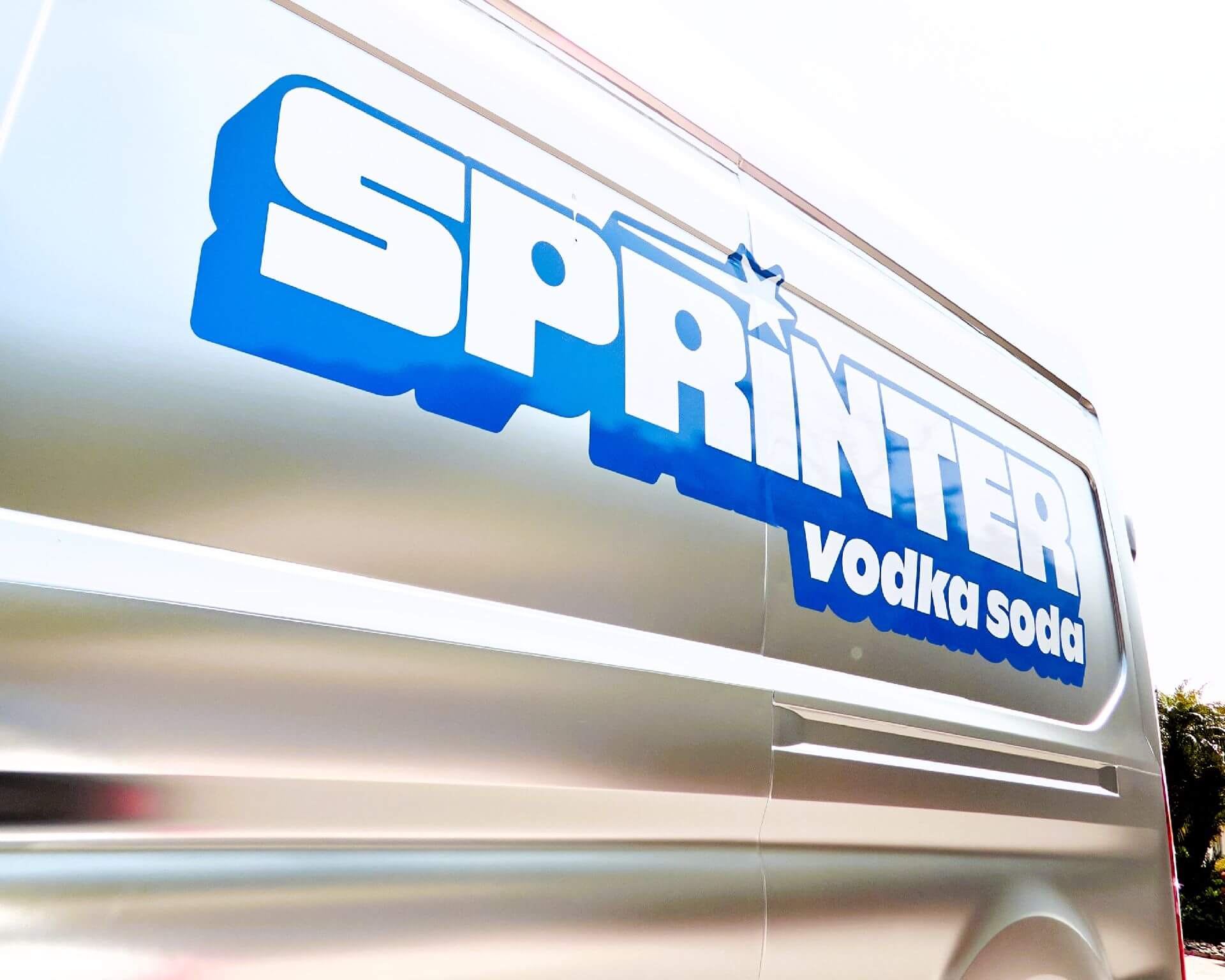 Side of sliver-wrapped Sprinter van with Sprinter Vodka Soda RTD logo