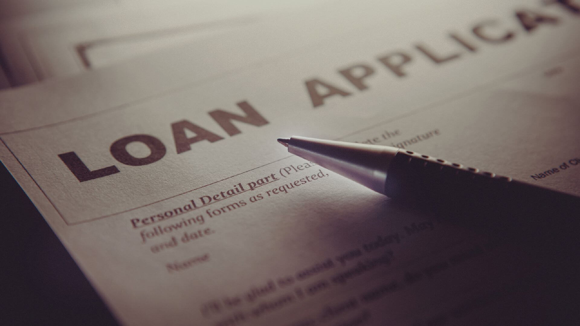 AI-generated image of a closeup of a loan application and pen